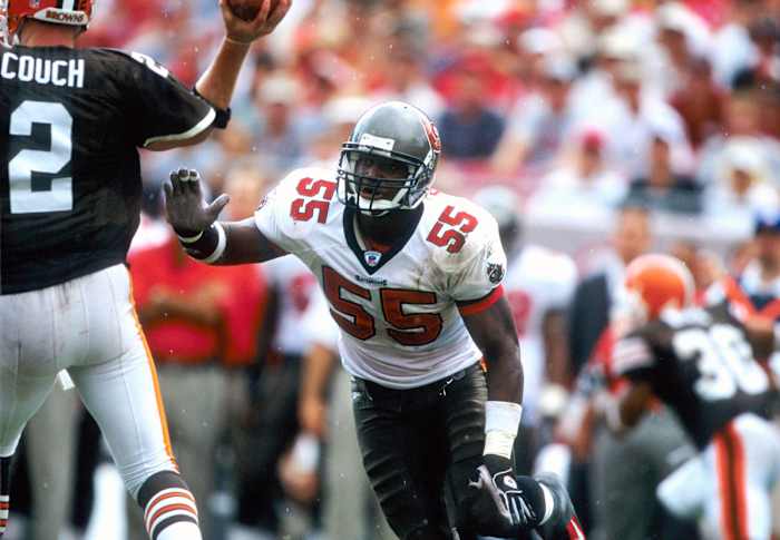 Former Tampa Bay linebacker Derrick Brooks lunges toward a Browns quarterback